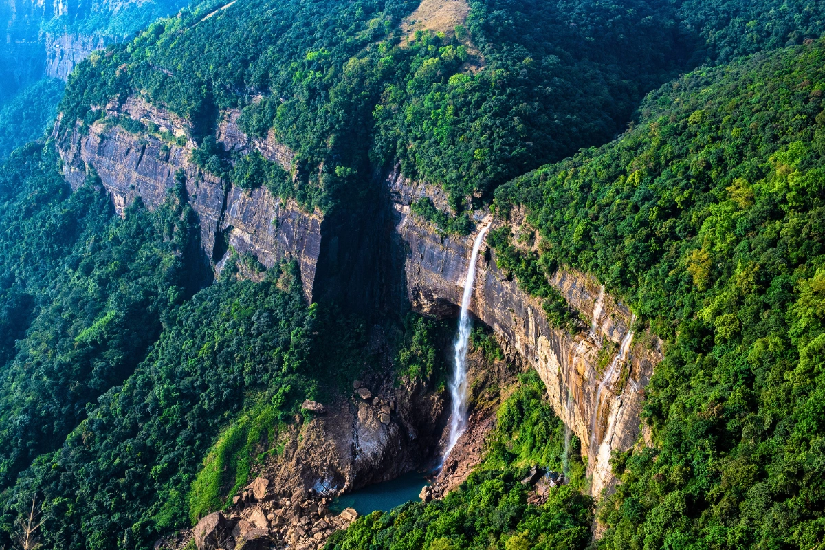 Meghalaya holiday packages featuring temple exploration wildlife safari and mountain experiences
